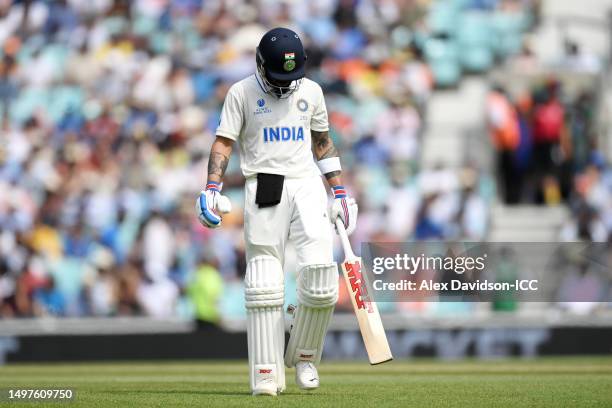 Virat Kohli of India walks off after being dismissed by Scott Boland of Australia during day five of the ICC World Test Championship Final between...