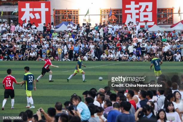Participants compete in a rural football game on June 10, 2023 in Qiandongnan Miao and Dong Autonomous Prefecture, Guizhou Province of China. The...