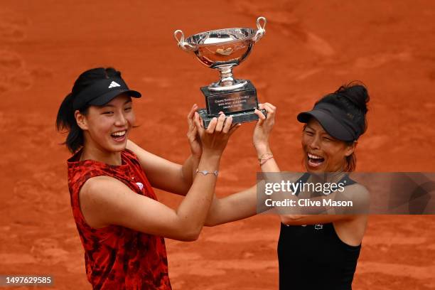 Xinyu Wang of People's Republic of China and Su-Wei Hsieh of Taipei pose with the winners trophy after victory against Leylah Fernandez of Canada and...