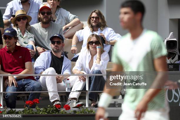 Ana Girardot and Oscar Louveau watch Carlos Alcaraz of Spain during the 2023 French Open at Roland Garros on June 09, 2023 in Paris, France.