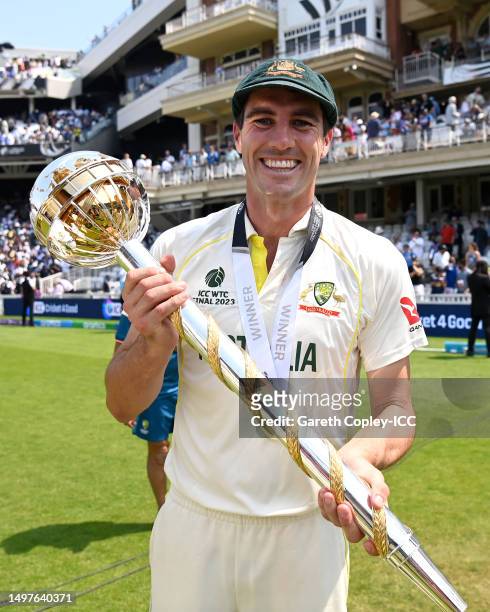 Pat Cummins of Australia poses for a photo with the ICC World Test Championship Mace on day five of the ICC World Test Championship Final between...