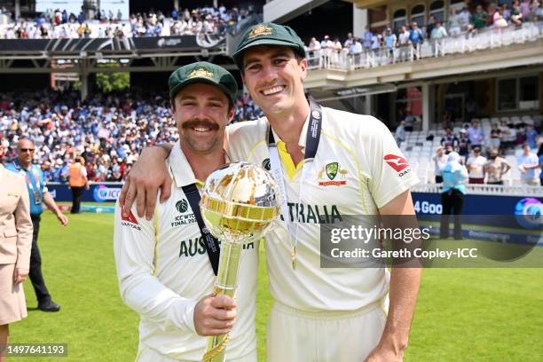 Travis Head and Pat Cummins of Australia pose for a photo with the ICC World Test Championship Mace on day five of the ICC World Test Championship...