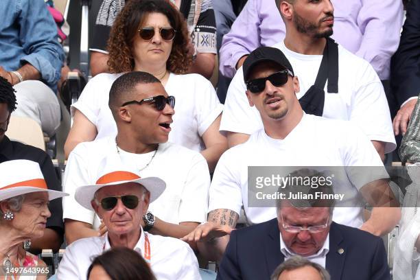 Footballer, Kylian Mbappe and Former Footballer, Zlatan Ibrahimovich are seen attending the Men's Singles Final match between Novak Djokovic of...