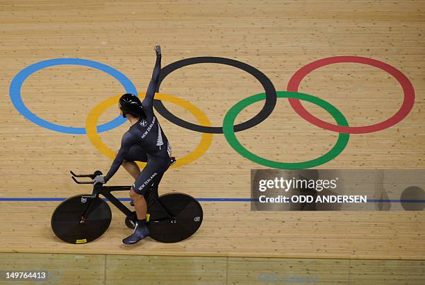 New Zealand rider celebrates after winning with teammates the bronze medal in the London 2012 Olympic Games men's team pursuit track cycling event at...