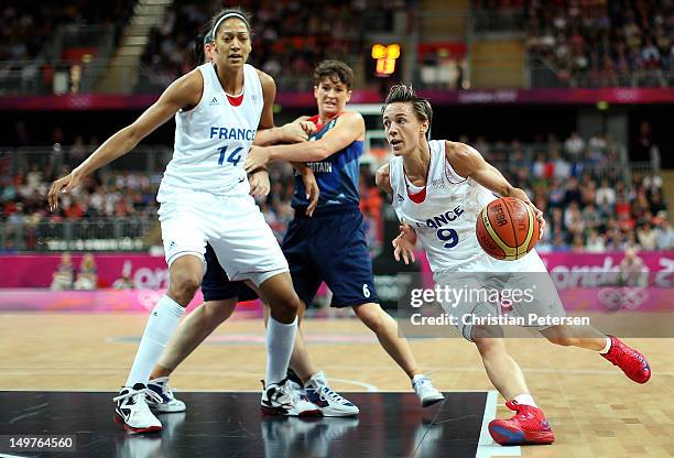 Celine Dumerc of France drives the ball past Stef Collins of Great Britain during the Women's Basketball Preliminary Round match on Day 7 of the...