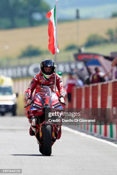Francesco Bagnaia of Italy and Ducati Lenovo Team celebrate the victory of the Race of MotoGP of Italy at Mugello Circuit on June 11, 2023 in...