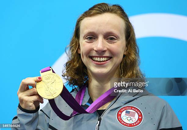 Gold medallist Katie Ledecky of the United States poses on the podium during the medal ceremony for the Women's 800m Freestyle on Day 7 of the London...