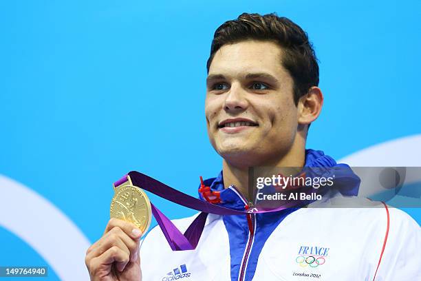 Gold medallist Florent Manaudou of France poses on the podium during the medal ceremony for the Mens 50m Freestyle Final on Day 7 of the London 2012...