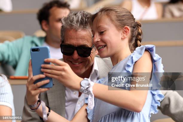 Actor Hugh Grant watches on from the crowd during the Men's Singles Final match between Novak Djokovic of Serbia and Casper Ruud of Norway on Day...