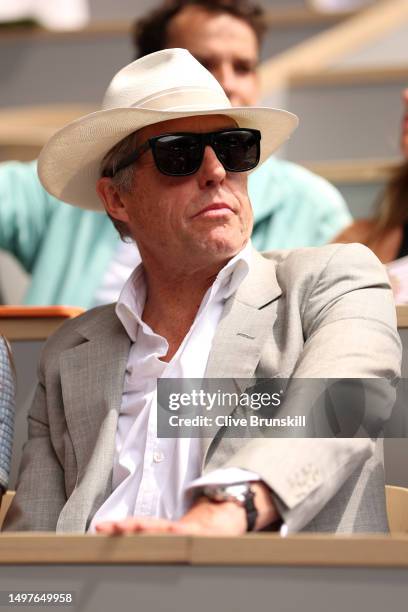 Actor Hugh Grant watches on from the crowd during the Men's Singles Final match between Novak Djokovic of Serbia and Casper Ruud of Norway on Day...