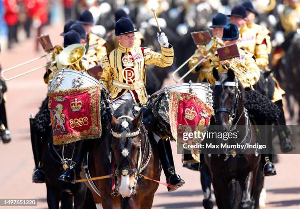 Drummer of The Mounted Band of The Household Cavalry rides, on horseback, down The Mall after taking part in Colonel's Review at Horse Guards Parade...