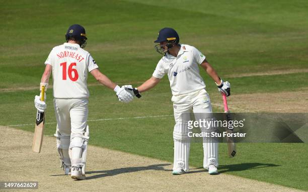 Glamorgan batsmen Kiran Carlson and Sam Northeast congratulate each other during their 150 partnership during day one of the LV= Insurance County...