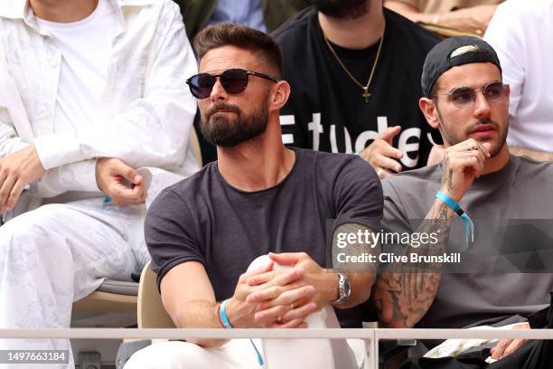 Footballer, Olivier Giroud, watches on during the Men's Singles Final match between Novak Djokovic of Serbia and Casper Ruud of Norway on Day Fifteen...