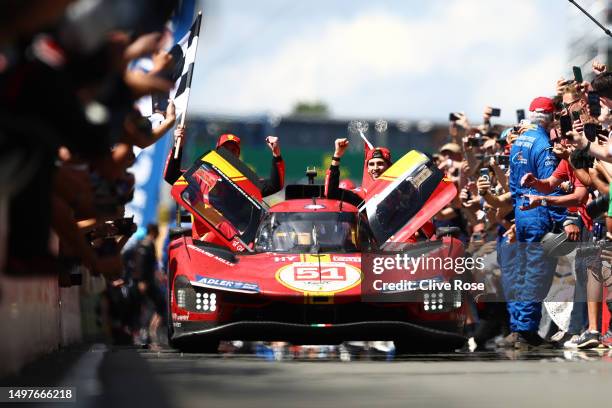 The No.51 Ferrari AF Corse Ferrari 499P of Alessandro Pier Guidi, James Calado and Antonio Giovinazzi drives down the pit lane to celebrate after...