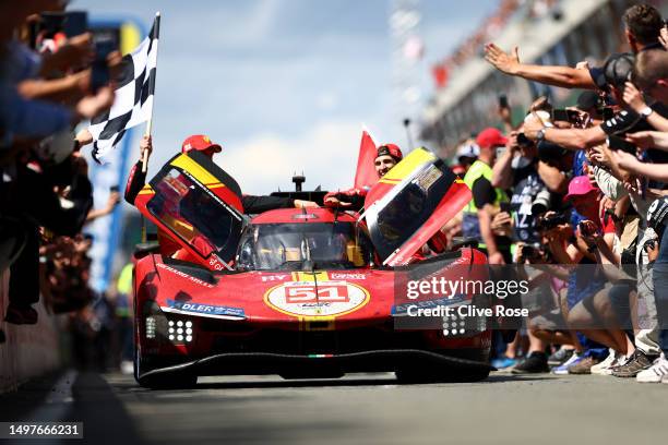 The No.51 Ferrari AF Corse Ferrari 499P of Alessandro Pier Guidi, James Calado and Antonio Giovinazzi drives down the pit lane to celebrate after...