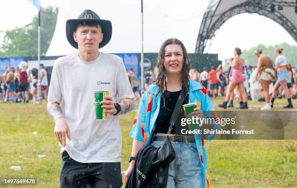 Festival goers endure a thunderstorm at Parklife Festival 2023 at Heaton Park on June 11, 2023 in Manchester, England.