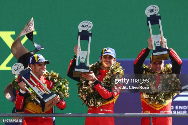 The No.51 Ferrari AF Corse Ferrari 499P team of Alessandro Pier Guidi, James Calado and Antonio Giovinazzi celebrate on the podium after winning the...