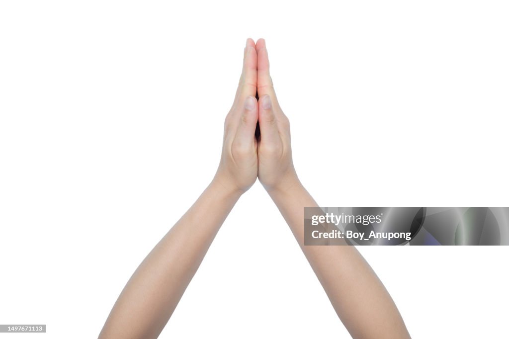 Cropped shot of woman hands showing gesture known as a 'Wai' isolated with white background.
