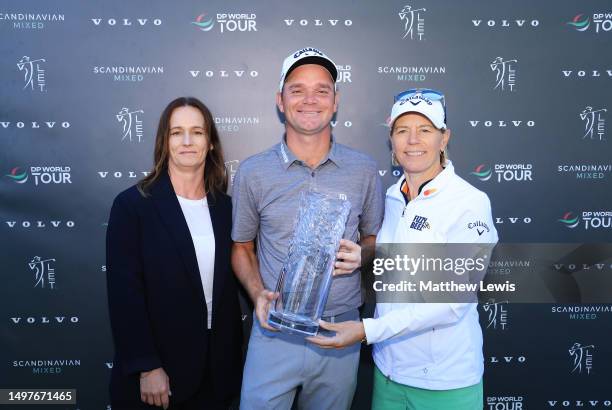 Dale Whitnell of England is presented with the trophy by Jessica Span, CEO of Volvo Car Sweden and Annika Sorenstam of Sweden, Tournament Host after...