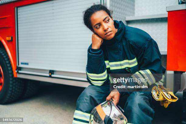 depressed firefighter after rescue operation - grief loss stock pictures, royalty-free photos & images