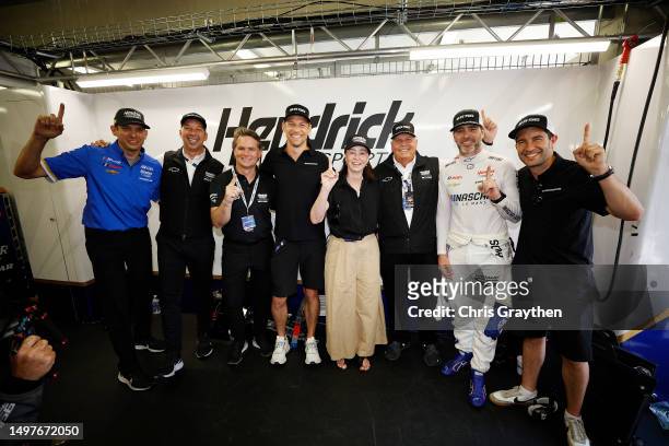 Greg Ives, Chad Knaus, Jeff Goredon Jenson Button, Linda Hendrick, Rick Hendrick, Jimmie Johnson and Mike Rockenfeller pose for a photo after NASCAR...
