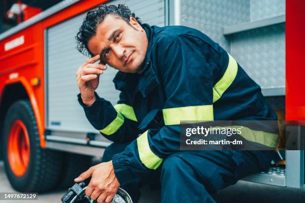 firefighter heroes - firefighter uniform stock pictures, royalty-free photos & images