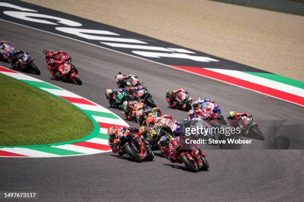 Francesco Bagnaia of Italy and Ducati Lenovo Team leads the race at turn one during the Race of the MotoGP Gran Premio d'Italia Oakley at Mugello...