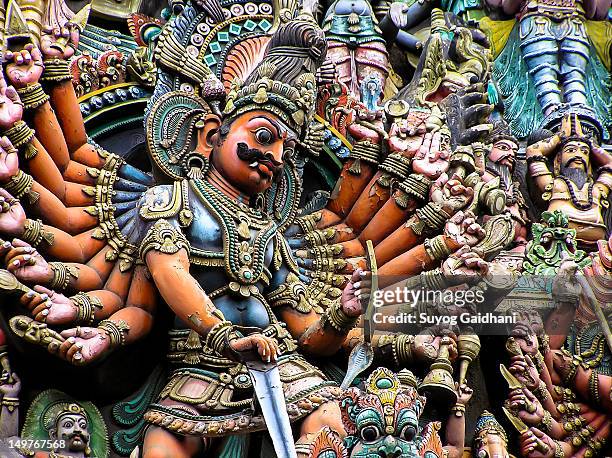 asura on madurai temple gopuram - sri meenakshi hindu temple stock pictures, royalty-free photos & images