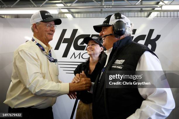 Jim France, Chairman and CEO of NASCAR and team owner Rick Hendrick celebrate as the NASCAR Next Gen Chevrolet ZL1 finishes the 100th anniversary of...