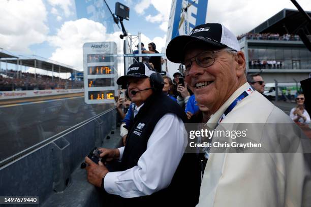 Jim France, Chairman and CEO of NASCAR and team owner Rick Hendrick celebrate as the NASCAR Next Gen Chevrolet ZL1 finishes the 100th anniversary of...