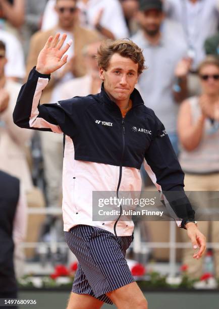 Casper Ruud of Norway acknowledges the crowd after defeat to Novak Djokovic of Serbia in the Men's Singles Final match on Day Fifteen of the 2023...