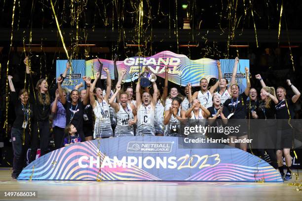 Natalie Panagarry of Loughborough Lightening lifts the trophy following her team's victory in the Netball Super League Grand Final Match between...