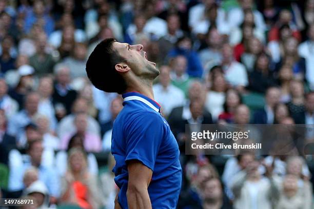 Novak Djokovic of Serbia reacts while playing against Andy Murray of Great Britain in the Semifinal of Men's Singles Tennis on Day 7 of the London...
