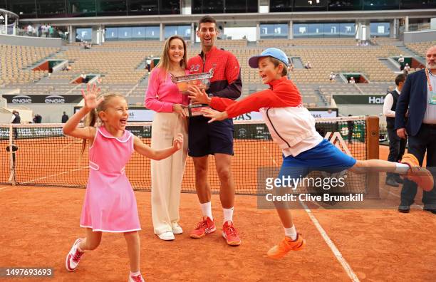 Novak Djokovic of Serbia, partner, Jelena Djokovic and their children pose for a photograph with the winners trophy after the Men's Singles Final...
