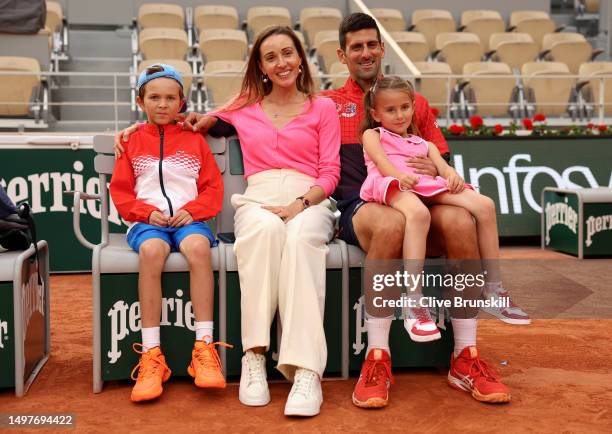 Novak Djokovic of Serbia, partner, Jelena Djokovic and their children pose for a photograph with the winners trophy after the Men's Singles Final...