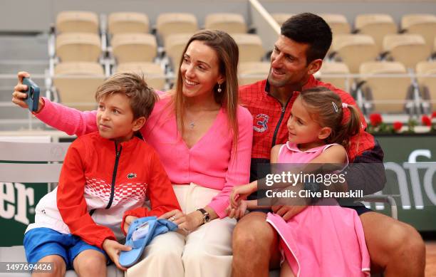 Novak Djokovic of Serbia, partner, Jelena Djokovic and their children pose for a photograph with the winners trophy after the Men's Singles Final...