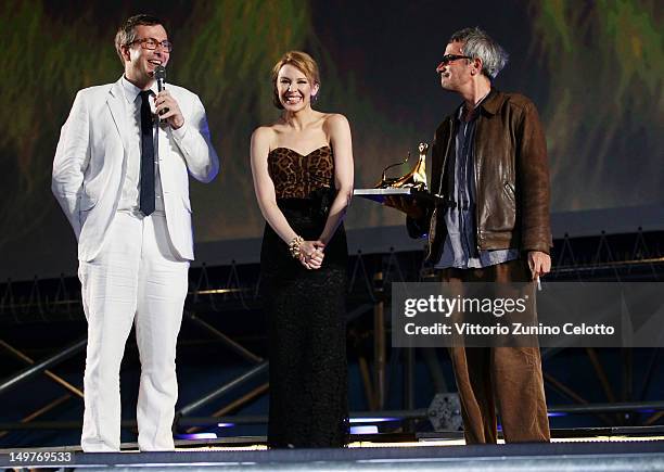 Olivier Pere, Kylie Minogue and Leos Carax attend the Swisscom Leopard of Honor To Leos Carax ceremony during the 65th Locarno Film Festival on...