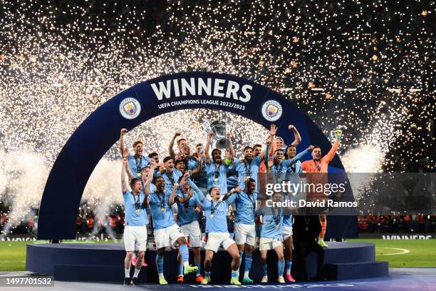 Ilkay Guendogan of Manchester City lifts the UEFA Champions League trophy after the team's victory during the UEFA Champions League 2022/23 final...