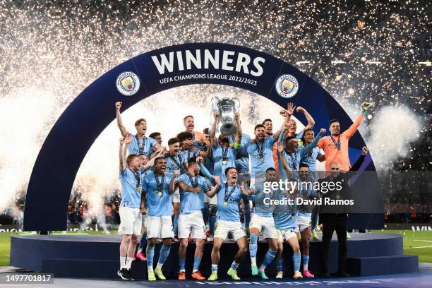 Ilkay Guendogan of Manchester City lifts the UEFA Champions League trophy after the team's victory during the UEFA Champions League 2022/23 final...