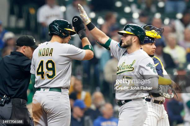 Seth Brown of the Oakland Athletics crosses home plate after hitting a three-run homer in the fourth inning against the Milwaukee Brewers at American...