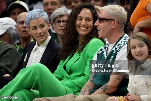 June 11: Megan Rapinoe, Sue Bird and Macklemore watch the game between the Seattle Storm and the Washington Mystics at The Space Needle on June 11,...