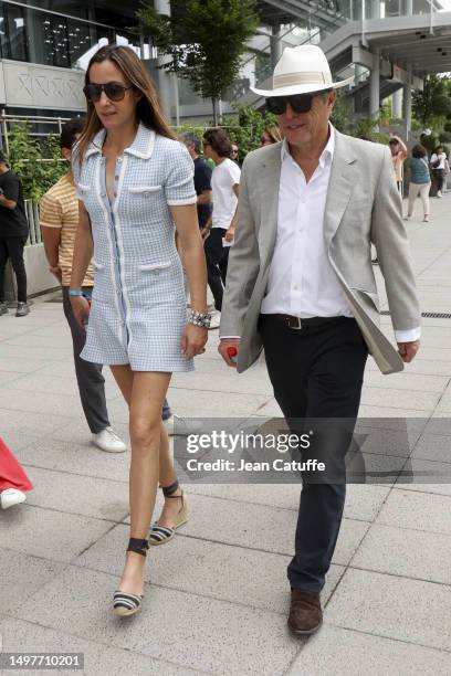 Anna Elisabet Eberstein and Hugh Grant attend the 2023 French Open at Roland Garros on June 11, 2023 in Paris, France.