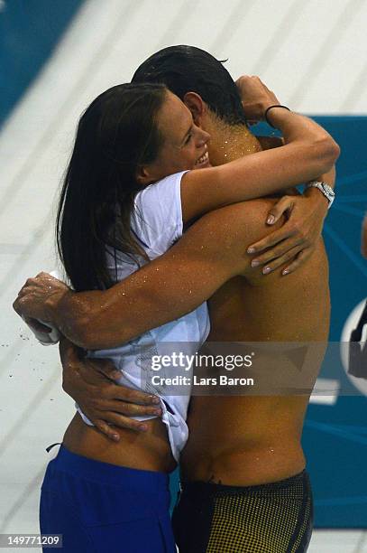 Florent Manaudou of France embraces his sister Laure Manaudou after winning the Mens 50m Freestyle Final on Day 7 of the London 2012 Olympic Games...
