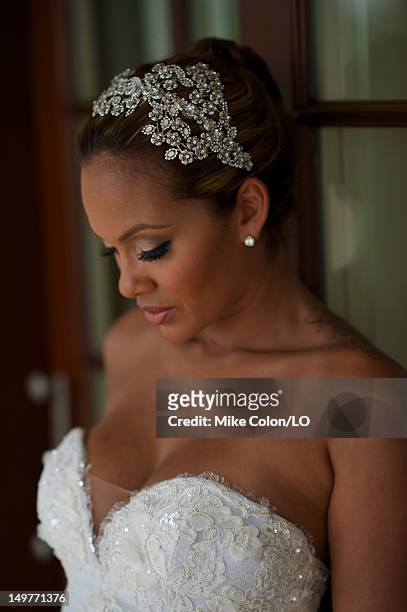 Evelyn Lozada poses for photos at her wedding to Chad Ochocinco at Le Chateau des Palmiers on July 4, 2012 in St. Maarten, Netherlands Antillies.
