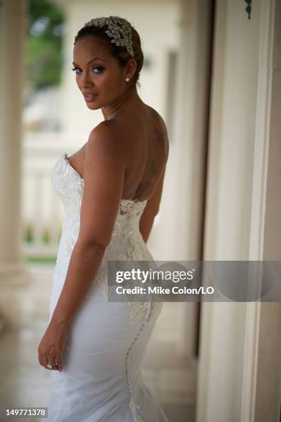 Evelyn Lozada poses for photos at her wedding to Chad Ochocinco at Le Chateau des Palmiers on July 4, 2012 in St. Maarten, Netherlands Antillies.