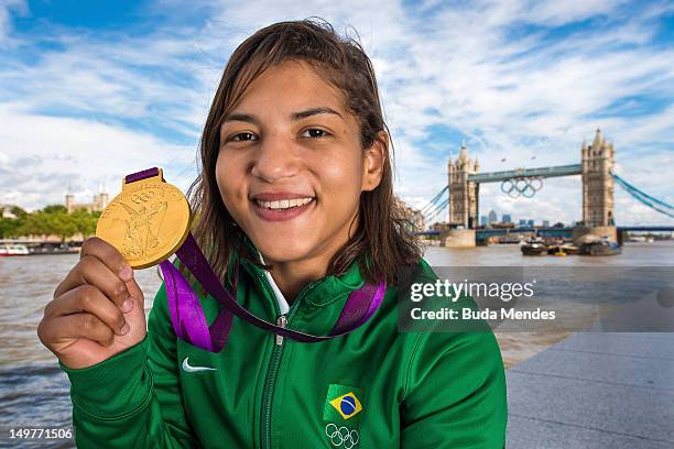 Sarah Menezes, Brazil's Olympic champion in judo category at 48 kg, poses for a picture during a photo session at Tower Bridge on August 03, 2012 in...
