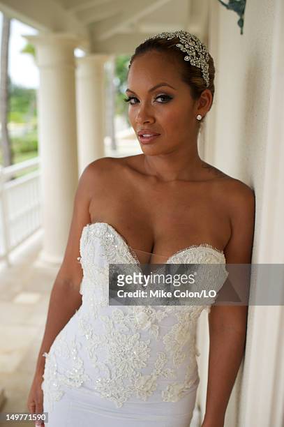 Evelyn Lozada poses for photos at her wedding to Chad Ochocinco at Le Chateau des Palmiers on July 4, 2012 in St. Maarten, Netherlands Antillies.