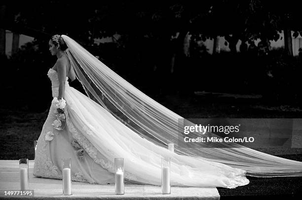 Evelyn Lozada walks down the aisle during her wedding to Chad Ochocinco at Le Chateau des Palmiers on July 4, 2012 in St. Maarten, Netherlands...