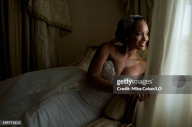 Evelyn Lozada poses for photos at her wedding to Chad Ochocinco at Le Chateau des Palmiers on July 4, 2012 in St. Maarten, Netherlands Antillies.