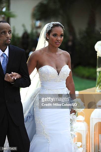Evelyn Lozada walks down the aisle during her wedding to Chad Ochocinco at Le Chateau des Palmiers on July 4, 2012 in St. Maarten, Netherlands...
